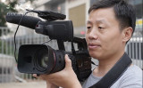 中国の暗部にカメラを向け続けている杜斌氏、氏はこうした暗部こそが中国の真の姿であり、多くの中国人が知らない、または気づいていない一面だと語る（大紀元）