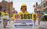 2021年7月18日、ニューヨーク州で行われた法輪功迫害22周年目を記念するパレードに参加する法輪功学習者たち（Chung I Ho/The Epoch Times）