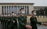 2021年10月9日、北京で開かれた辛亥革命110周年の記念式典の後、行進する軍事代表団（Noel Celis/AFP via Getty Images）