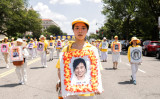 2021年7月16日、ワシントンで行われた中国共産党による法輪功迫害22周年記念パレードに参加する法輪功学習者たち（Samira Bouaou/The Epoch Times）